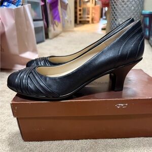 Brand new black pumps size 10
